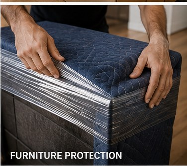 Crew wrapping furniture in protective plastic